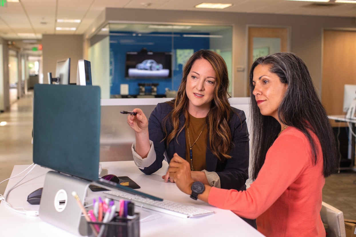 women reviewing computer together